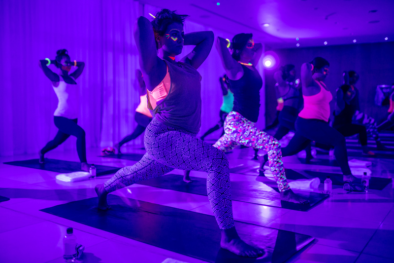 GET ACTIVE: Yoga studio adds glow in the dark, '80s theme to pump up fun